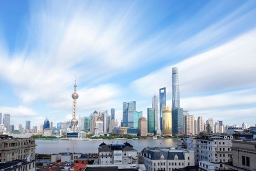A beautiful shot of Pudong New Area in Shanghai with the Huangpu River on a sunny day