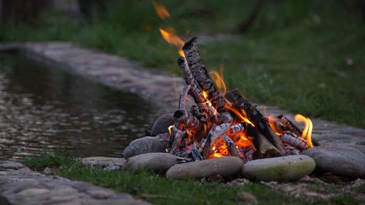 A selective focus shot of a bonfire in the garden