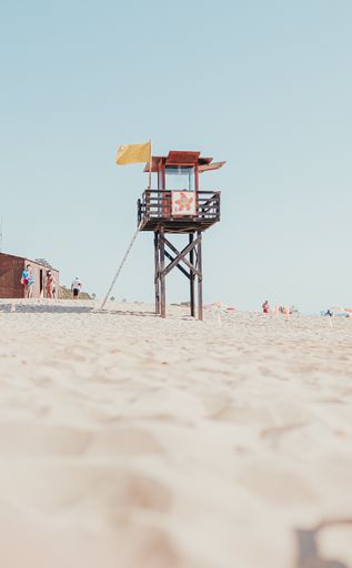A vertical shot of a lifeguard tower