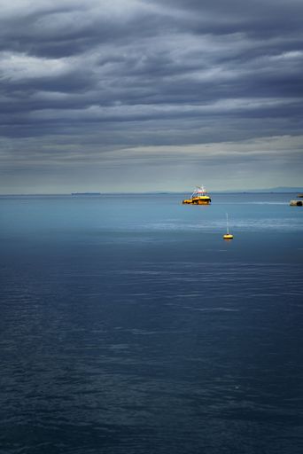 Yellow Boat on open sea in trieste in italy
