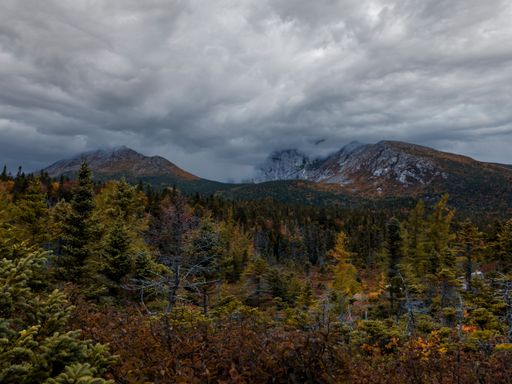 A scenic view from Chimney Pond Trail looking at the Baxter Peak on a cloudy day in Maine, United States