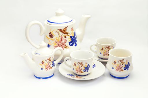 a closeup of Beautiful floral pattern teacup porcelain teapot with plate isolated on white background