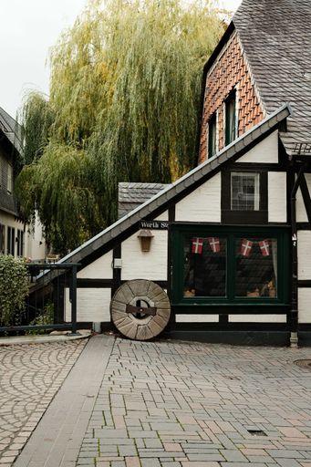 A vertical shot of the Old Worthmuehle at the Abzucht in autumn in Goslar, Germany