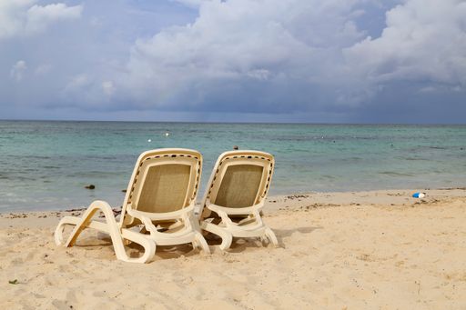 A closeup shot of sun loungers on the beach