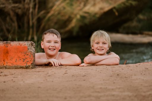 A shallow focus shot of two little boys in the swimming pool