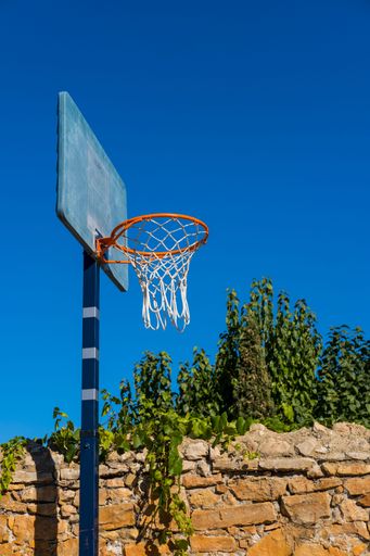 A beautiful closeup of a basketball hoop in a park
