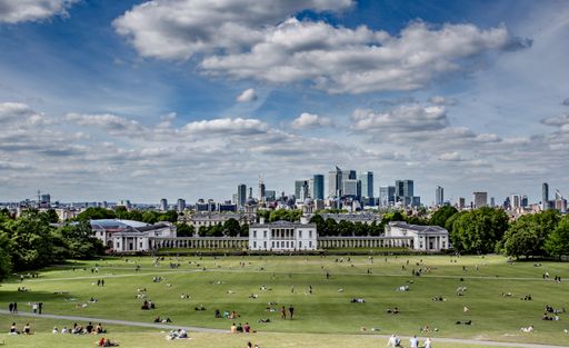 Greenwich park at sunny spring day. Greenwich Park is a former hunting park in Greenwich.View of the National Maritime Museum and Canary Wharf