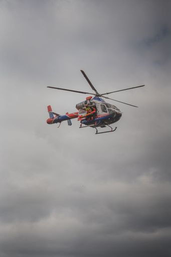 Luxembourg Air Rescue transporting a person using the fast rope system.