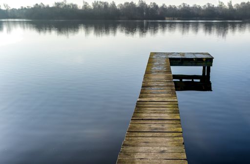Early morning lake view with small pier in Groningen (NL)