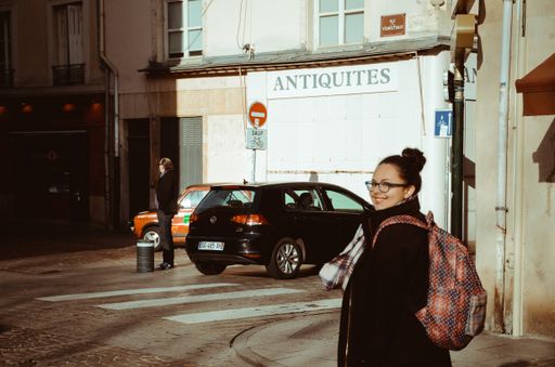 Beautiful vintage portrait shot of a tourist girl in interior Nancy France.