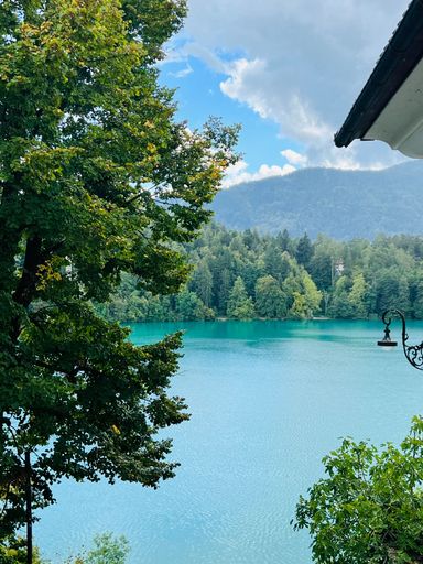 A vertical shot of the scenic Lake Bled under the blue sky in Slovenia