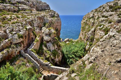 A defensive stop wall built by the British military in Wied Znuber valley, Malta, to stop sea invasion. Equipped with musketry loophole and parapet.