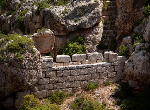 A defensive stop wall built by the British military in Wied Znuber valley, Malta, to stop sea invasion. Equipped with musketry loophole and parapet.
