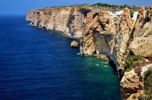 High sheer cliffs along the southern coastline of the Maltese Islands. Geological formation of cliffs formed out of limestone and sea erosion. Malta