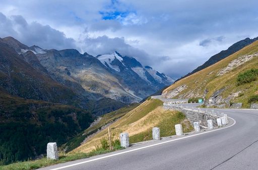 A landscape of a road  on Grossglockner high alpine. Austrian Alps with snowy green mountains