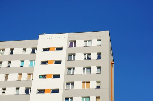 An apartment building against the blue sky