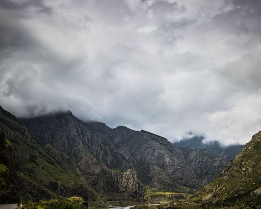 A mesmerizing view of a beautiful mountainous landscape on a cloudy day