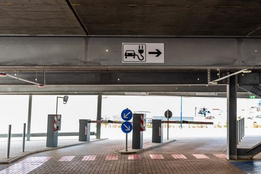 A view of empty parking with an electric vehicle charging station