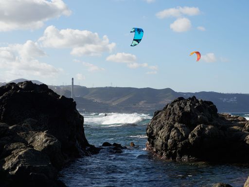 A beautiful view of kitesurfing over the sea in Telde, Gran Canaria, Canary Islands.