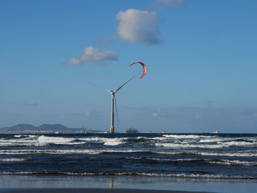 A beautiful view of kitesurfing over the sea in Telde, Gran Canaria, Canary Islands.