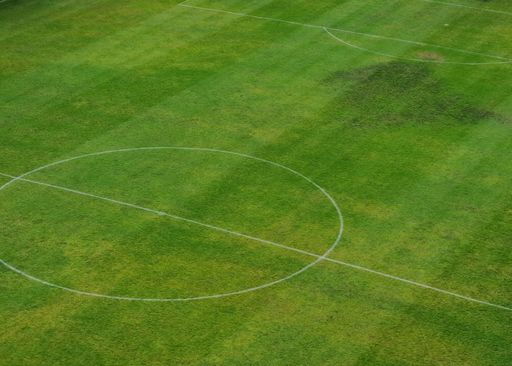 center of a grass soccer field aerial view. sport concept