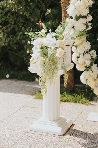 The details of white floral elegant decorations of outdoor wedding reception venue