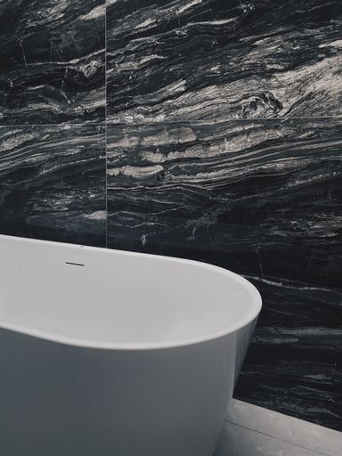 A vertical grayscale of a bathroom