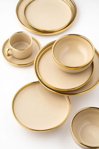 A Set of light brown ceramic plate and cup on a white background