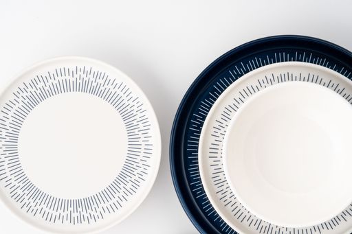 A set of blue and white luxury ceramic kitchen utensils on a white background