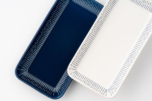 A set of blue and white luxury ceramic kitchen utensils on a white background