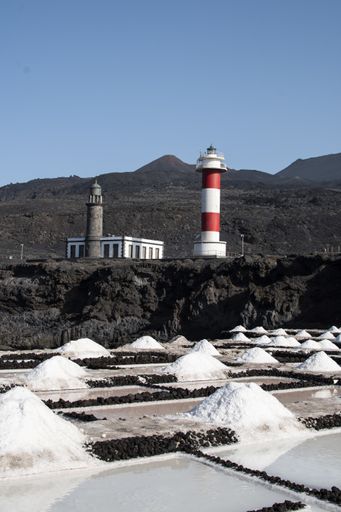 A beautiful shot of a lighthouse near a salt mine