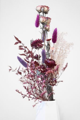 A vertical shot of beautiful flowers in a vase