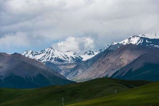 Beautiful mountains in Xinjiang against a blue cloudy sky