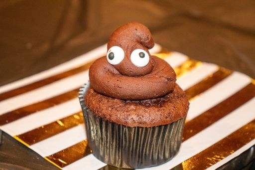 A closeup shot of a chocolate cupcake like a poop