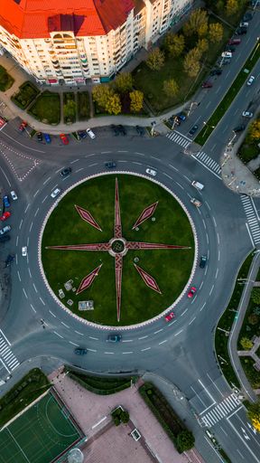 An aerial drone shot of a roundabout in Targoviste with traffic