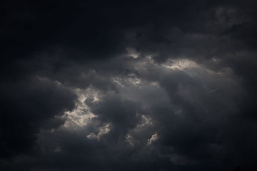 A background of a grey cloudy sky on a gloomy night