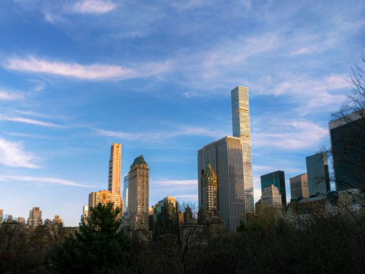A beautiful shot of modern downtown buildings over Central Park in New York City