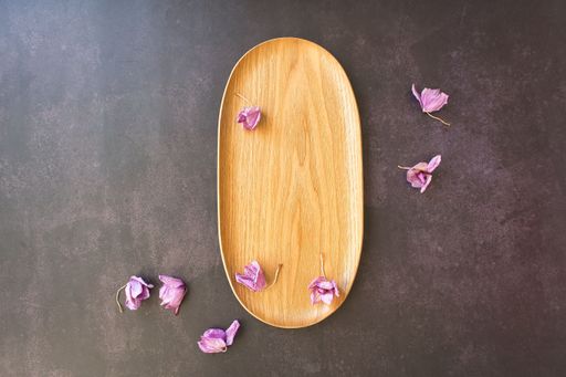 A top view of a rustic wooden tray decorated with dried lavender flowers