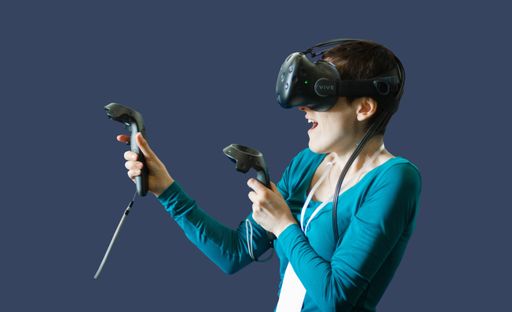 A portrait of a female wearing a VR headset - isolated on a blue background