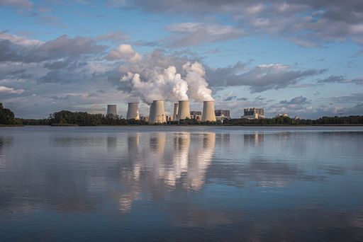 View of the Jaenschwalde power plant behind the pond.
