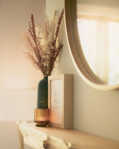 A vertical shot of the beautiful cozy decorations in the bedroom