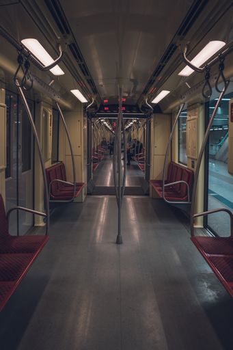 Inside of an empty subway train with opened doors
