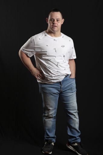 A shallow focus shot of a middle-aged male isolated on a black background