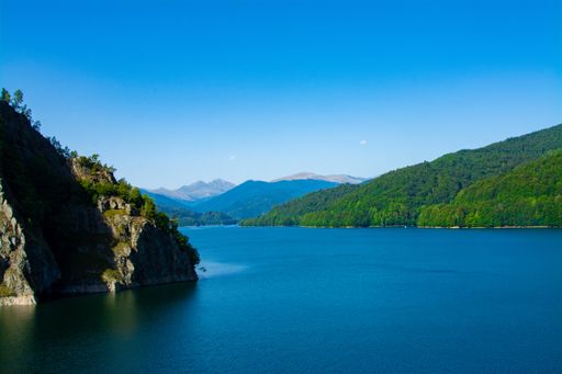 An aerial shot of the Vidraru lake in the Fagaras Mountains - Romania