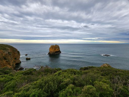 A beautiful shot of a seascape near hills during the day