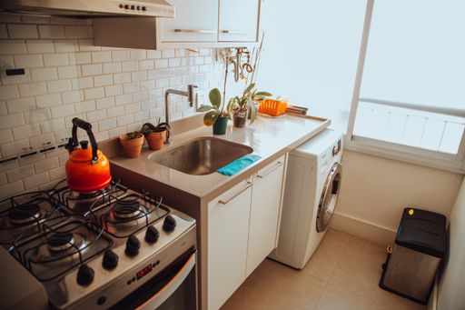 A cozy residential kitchen with windows