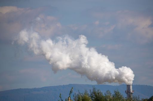 noxes coming out of an industrial chimney, smoke