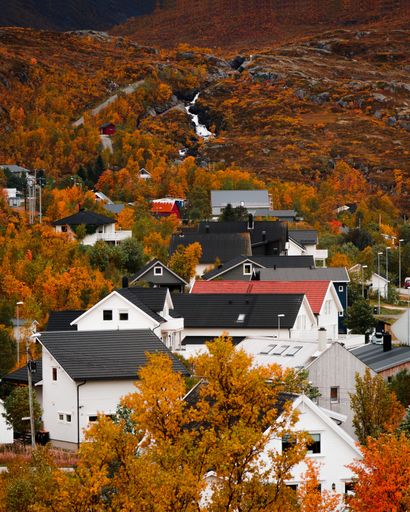 A peaceful small town surrounded by beautiful fall foliage in Northern Norway.