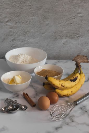 A vertical shot of ingredients for baking banana bread in the kitchen