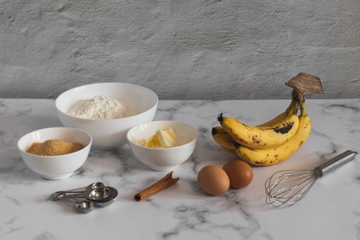 A selective focus shot of ingredients for baking banana bread in the kitchen